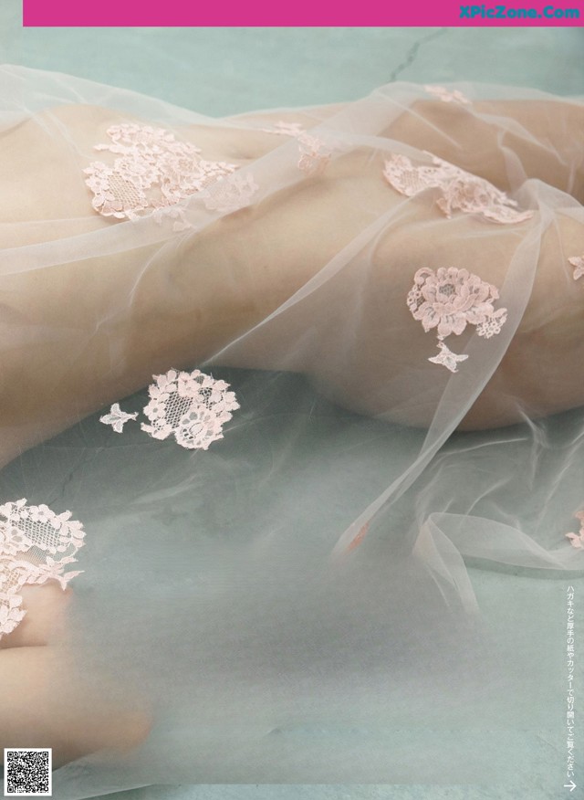 A magazine with a picture of a woman's legs covered in lace.