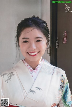 A collage of four pictures of a woman in a kimono.