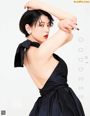 A woman in a purple dress on the cover of a magazine.